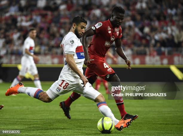 Lyon's French midfielder Nabil Fekir vies with Dijon's Senegalese defender Papy Djilobodji during the French L1 football match between Dijon FCO and...