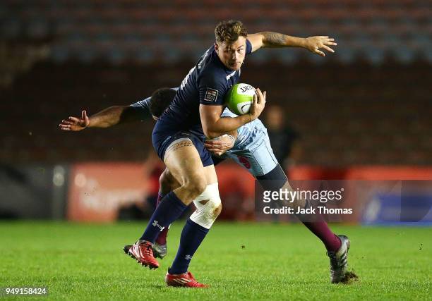Eldon Meyers of the Royal Navy Senior XV is tackled by Sgt Lee Queeley of the Royal Air Force Seniors at Twickenham Stoop on April 20, 2018 in...