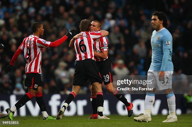 Sunderland captain Lee Cattermole congratulates scorer Jordan Henderson after scoring the second Sunderland goal during the Barclays Premier League...