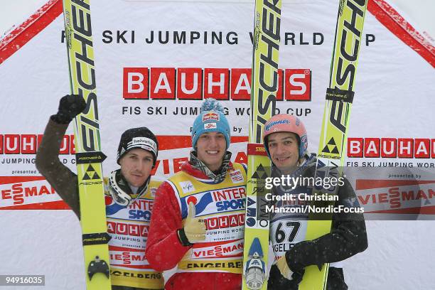 Simon Ammann of Switzerland , Gregor Schlierenzauer of Austria and Andreas Kofler of Austria during the flower ceremony after the Individual Large...