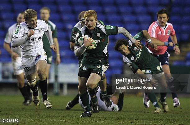 Tom Homer of London Irish races away with the ball during the Heineken Cup match between London Irish and Brive at the Madejski Stadium on December...