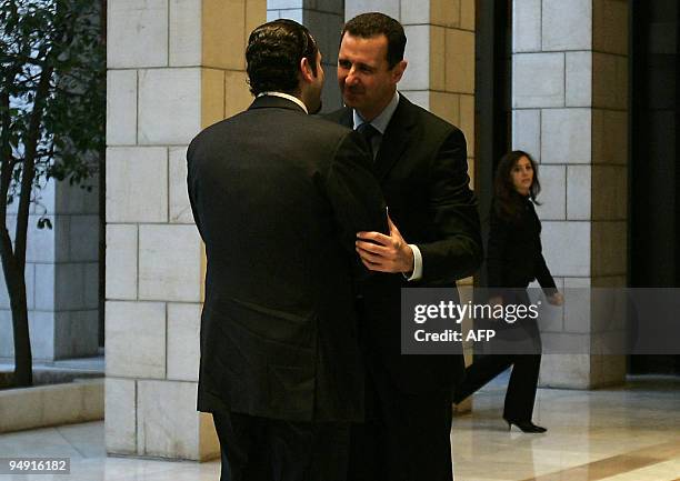 Syrian President Bashar al-Assad greets Lebanese Prime Minister Saad Hariri upon his arrival for a meeting in Damascus on December 19, 2009. Hariri...