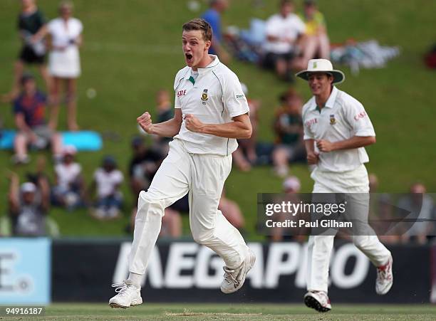 Morne Morkel of South Africa celebrates taking the wicket of Andrew Strauss of England for 1 run during day four of the first test match between...