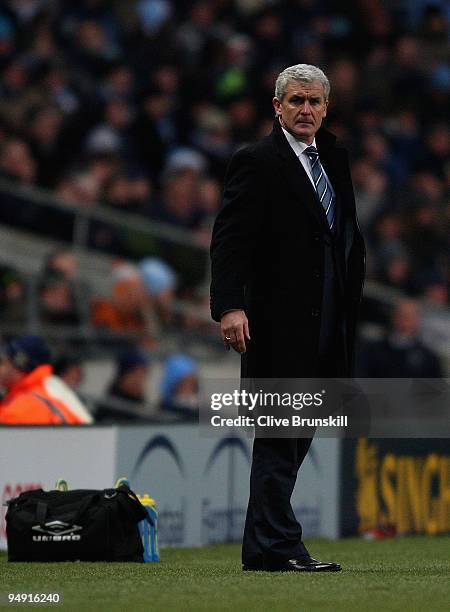 Manchester City manager Mark Hughes watches his players during the Barclays Premier League match between Manchester City and Sunderland at the City...