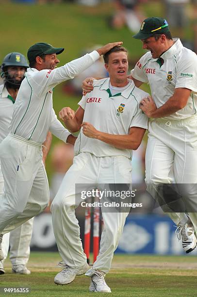 Morne Morkel of South Africa celebrates the wicket of Andrew Strauss of England for 1 run during day 4 of the 1st Test match between South Africa and...