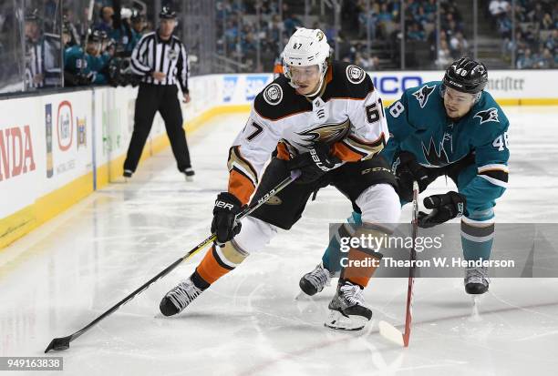 Rickard Rakell of the Anaheim Ducks and Tomas Hertl of the San Jose Sharks battles for control of the puck during the third period in Game Four of...