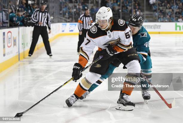 Rickard Rakell of the Anaheim Ducks and Tomas Hertl of the San Jose Sharks battles for control of the puck during the third period in Game Four of...