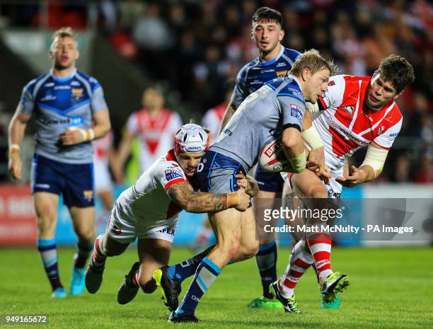 Huddersfield Giants' Ryan Hinchcliffe is tackled by St Helens' Alex Walmsley during the Betfred Super League match at the Totally Wicked Stadium, St...