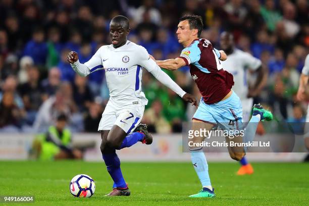 Jack Cork of Burnley in action with N'Golo Kante of Chelsea during the Premier League match between Burnley and Chelsea at Turf Moor on April 19,...