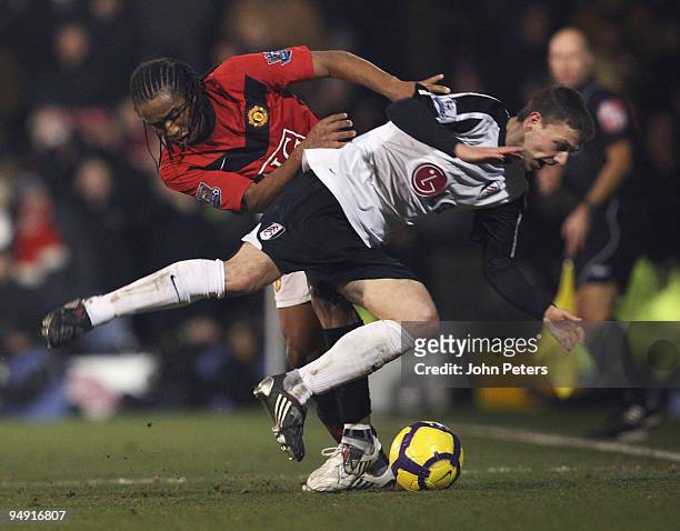 Anderson of Manchester United clashes with Chris Baird of Fulham during the FA Barclays Premier League match between Fulham and Manchester United at...