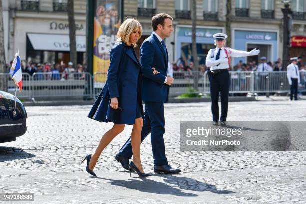 The President of the Republic, Emmanuel Macron and his wife Brigitte Macron arrive to attend a ceremony, on April 20 in tribute to Xavier Jugele, a...