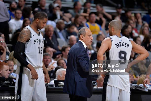 Assistant Coach Ettore Messina and Tony Parker of the San Antonio Spurs talk during Game Three of the Western Conference Quarterfinals against the...