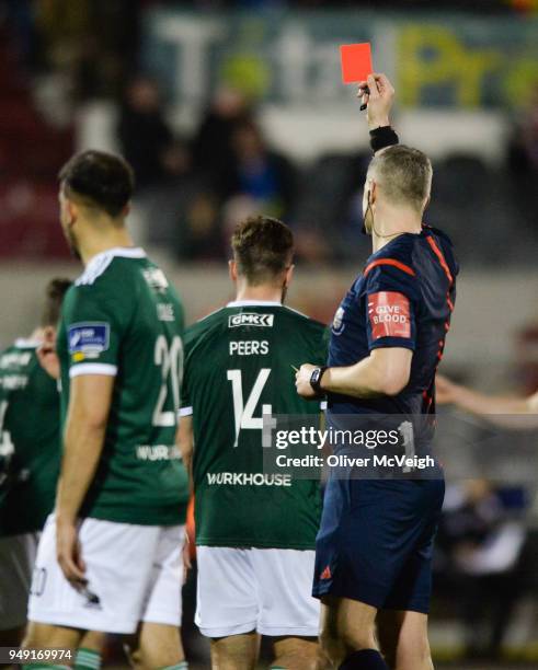 Dundalk , Ireland - 20 March 2018; Referee Ben Connolly shows Gavin Peers of Derry City a rd card late in the game during the SSE Airtricity League...