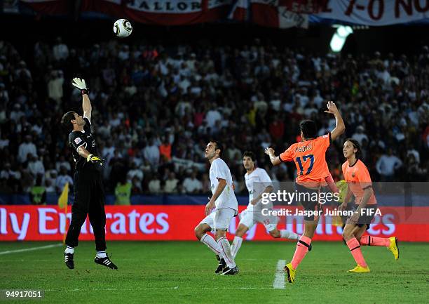 Pedro Rodriguez of FC Barcelona heads in his sides last minute equalizing goal past goalkeeper Damian Albil of Estudiantes during the FIFA Club World...