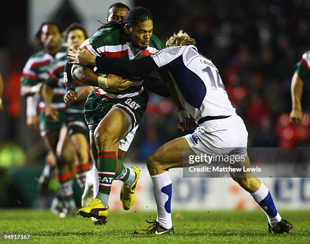 Alesana Tuilagi of Leicester is tackled by Aurelien Rougerie of ASM Clermont Auvergne during the Heineken Cup match between Leicester Tigers and ASM...
