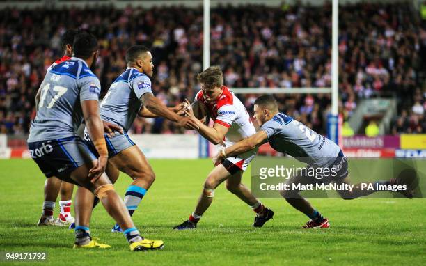 St Helens' Ryan Morgan takes on Huddersfield Giants' Darnell McIntosh during the Betfred Super League match at the Totally Wicked Stadium, St Helens.