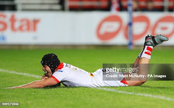 St Helens' Jonny Lomax scores a try during the Betfred Super League match at the Totally Wicked Stadium, St Helens.
