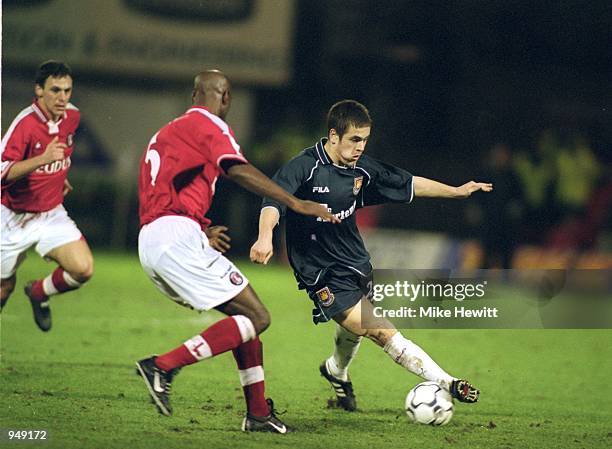 Joe Cole of West Ham takes on Richard Rufus of Charlton Athletic during the FA Carling Premiership match played at The Valley, in London. The match...