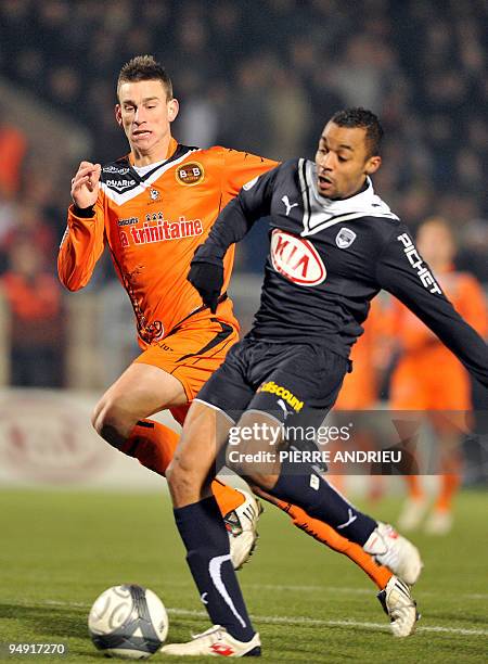 Bordeaux's forward David Bellion fights for the ball with Lorient's defender Laurent Koscielny during the French L1 football match Bordeaux vs....