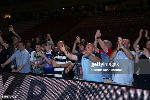 Fans celebrate the Royal Air Force winning The Wavell Wakefield Cup at Twickenham Stoop on April 20, 2018 in London, England.