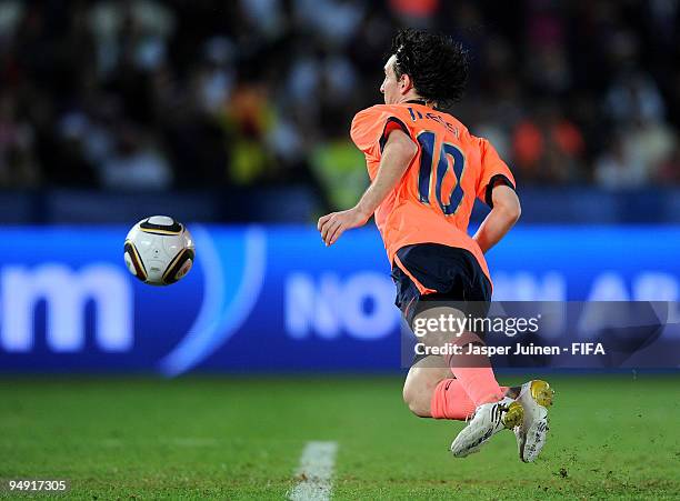 Lionel Messi of FC Barcelona scores the winning 2:1 goal in extra time during the FIFA Club World Cup Final match between Estudiantes LP and FC...