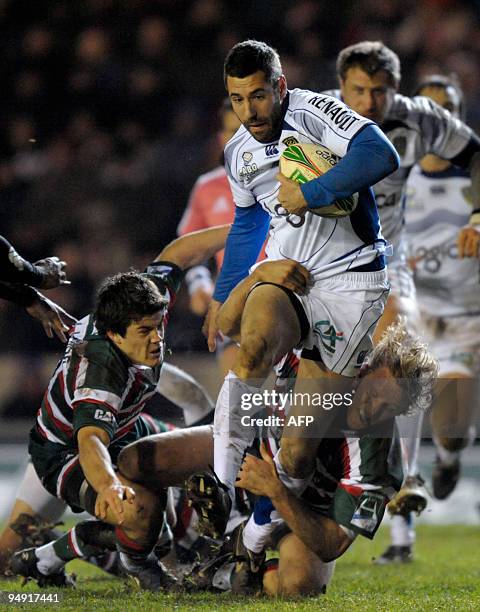 Clermont Auvergne's Julien Malzieu competes for the ball against Leicester Tigers Anthony Allan and Lewis Moody during their European Cup rugby union...