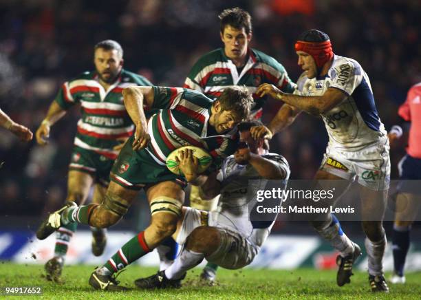 Geoff Parling of Leicester is tackled by Mario Ledesma of ASM Clermont Auvergne during the Heineken Cup match between Leicester Tigers and ASM...