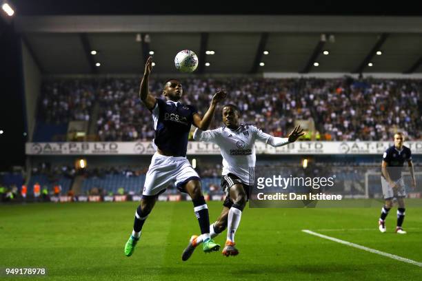 Mahlon Romeo of Millwall battles for the ball with Ryan Sessegnon of Fulham during the Sky Bet Championship match between Millwall and Fulham at The...