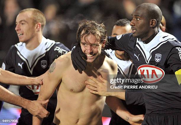 Bordeaux's Fernando Cavenaghi celebrates with team mates Mathieu Chalme and Alou Diarra after a goal during the French L1 football match Bordeaux vs...