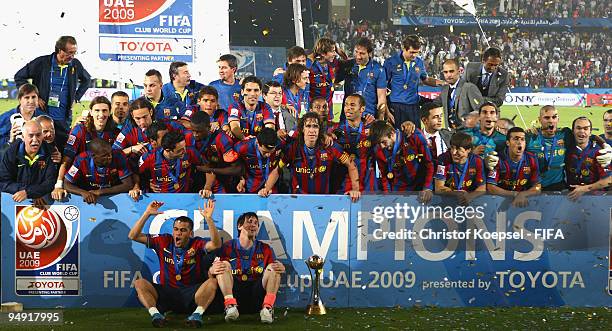 The Barcelona squad celebrates with the cup after winning 2-1 after extra time the FIFA Club World Cup Final match between Estudiantes LP and FC...