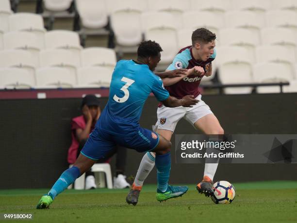 Conor Coventry of West Ham United in action with Tolaji Bola of Arsenal during the Premier League 2 match between West Ham United and Arsenal at...