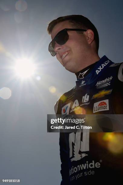 Alex Bowman, driver of the Nationwide Chevrolet, walks to his car during qualifying for the Monster Energy NASCAR Cup Series Toyota Owners 400 at...