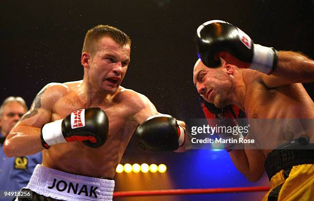 Damian Jonak of Poland exchanges punches with Nicolas Guisset of France during the super welterweight fight during the Universum Champions night...