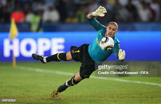 Goalkeeper Víctor Valdes of FC Barcelona saves the ball during the FIFA Club World Cup Final match between Estudiantes LP and FC Barcelona at the...
