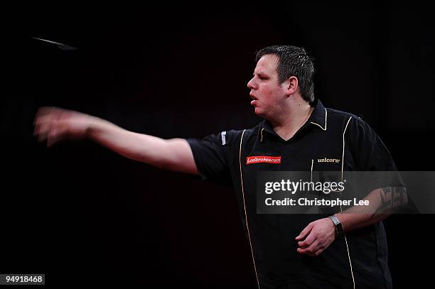 Adrian Lewis of England in action against Aodhagan O'Neill of Republic of Ireland during the 2010 Ladbrokes.com World Darts Championship Round One at...