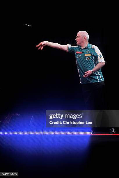Aodhagan O'Neill of Republic of Ireland in action against Adrian Lewis of England during the 2010 Ladbrokes.com World Darts Championship Round One at...