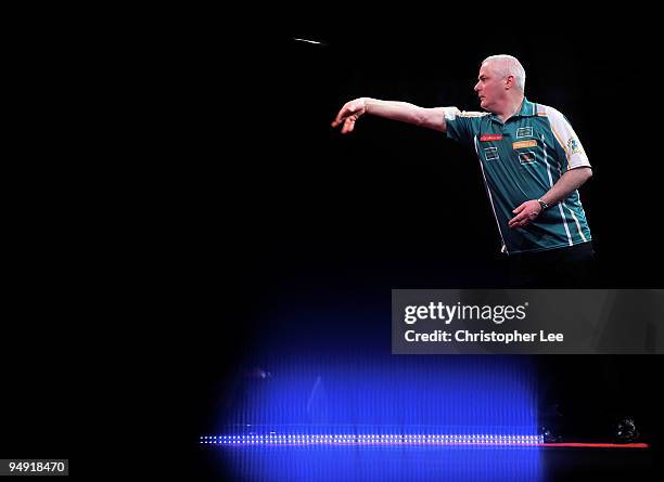 Aodhagan O'Neill of Republic of Ireland in action against Adrian Lewis of England during the 2010 Ladbrokes.com World Darts Championship Round One at...