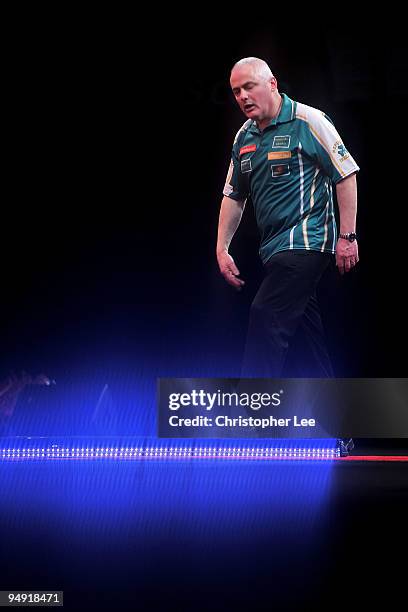 Aodhagan O'Neill of Republic of Ireland looks dejected as he loses against Adrian Lewis of England during the 2010 Ladbrokes.com World Darts...
