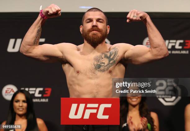 Jim Miller poses on the scale during the UFC Fight Night weigh-in at the Boardwalk Hall on April 20, 2018 in Atlantic City, New Jersey.