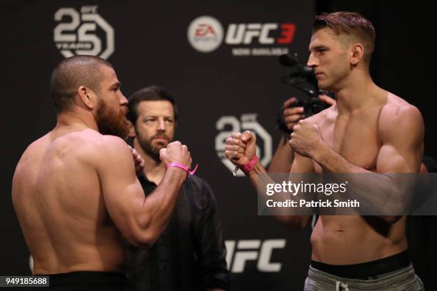 Opponents Jim Miller and Dan Hooker of New Zealand face off during the UFC Fight Night weigh-in at the Boardwalk Hall on April 20, 2018 in Atlantic...