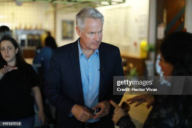 Photographer John Moore speaks during the launch event of Undocumented book at WeWork Varsovia Building on April 19, 2018 in Mexico City, Mexico.