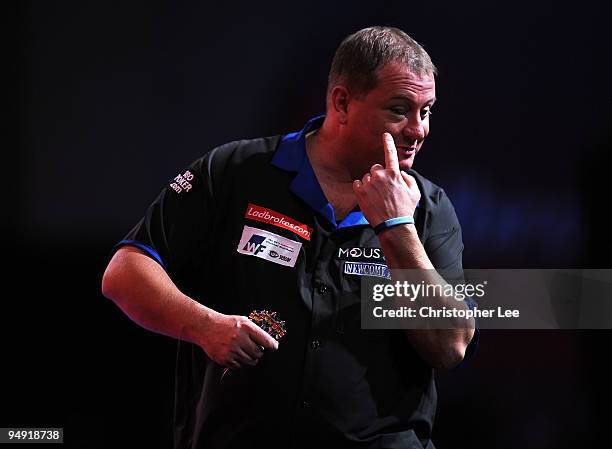 Andy Jenkins of England points out his black eye as he plays against Peter Manley of England during the 2010 Ladbrokes.com World Darts Championship...