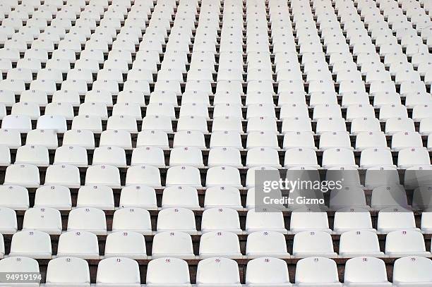 numerous rows of white stadium seats - empty stadium stockfoto's en -beelden