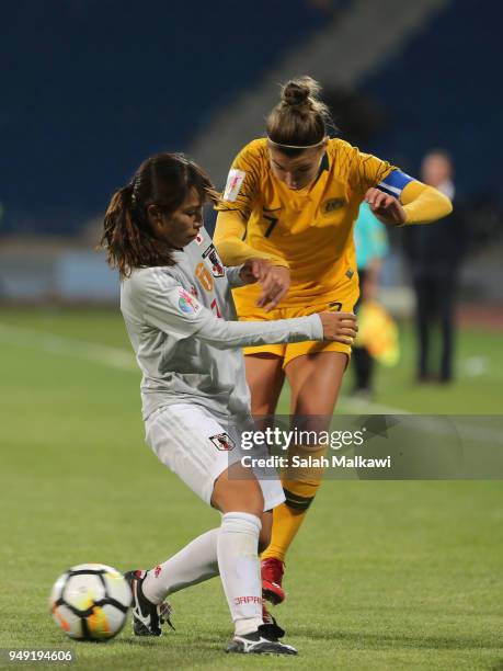 Stephanie Catley of Australia and Emi Nakajima of Japan in action during the AFC Women's Asian Cup final between Japan and Australia at the Amman...