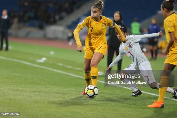 Stephanie Catley of Australia and Emi Nakajima of Japan challenge for the ball during the AFC Women's Asian Cup final between Japan and Australia at...