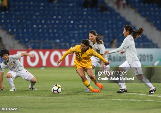 Samantha may Kerr of Australia and Emi Nakajima of Japan challenge for the ball during the AFC Women's Asian Cup final between Japan and Australia at...