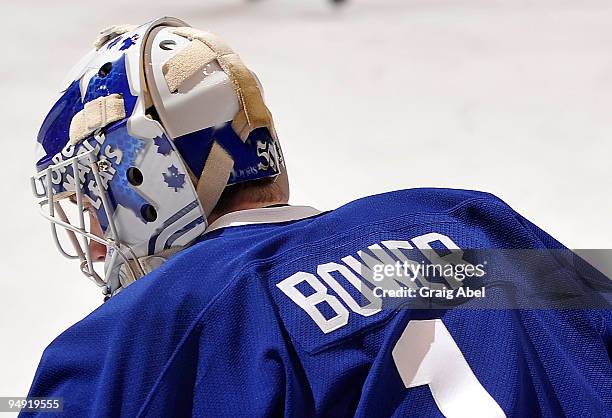 Jonas Gustavsson of the Toronto Maple Leafs wearing a retro Johnny Bower jersey looks on during warm up prior to game action against the Boston...