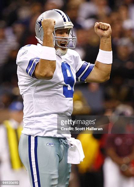 Quarterback Tony Romo of the Dallas Cowboys celebrates after throwing for his second touchdown against the New Orleans Saints at the Louisiana...
