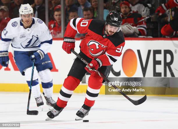 Marcus Johansson of the New Jersey Devils controls the puck in Game Four of the Eastern Conference First Round against the Tampa Bay Lightning during...