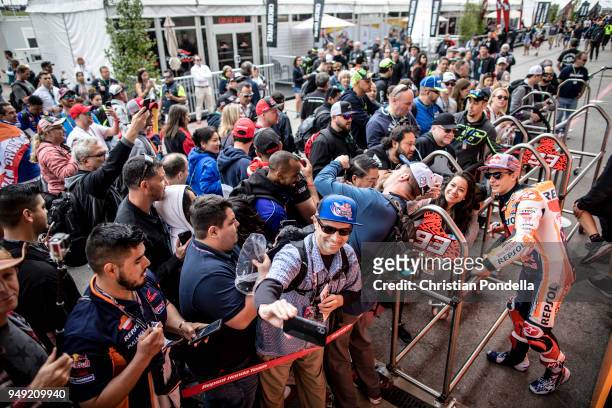 Marc Marquez of Spain signs autographs after the MotoGP Red Bull U.S. Grand Prix of The Americas - Free Practice 2 at Circuit of The Americas on...